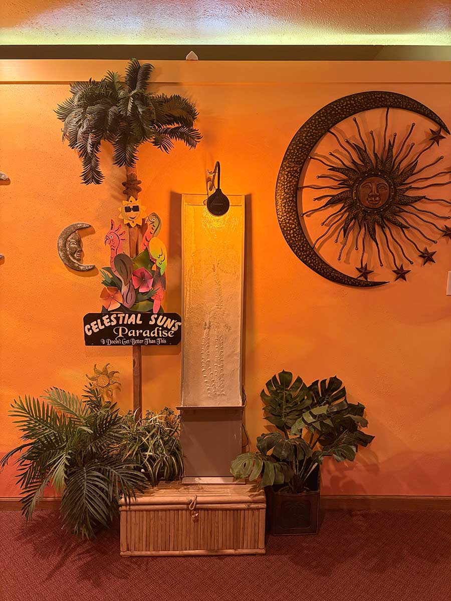 Celestial Sun lobby entrance with warm sun decor and relaxing water fountain in Byron IL
