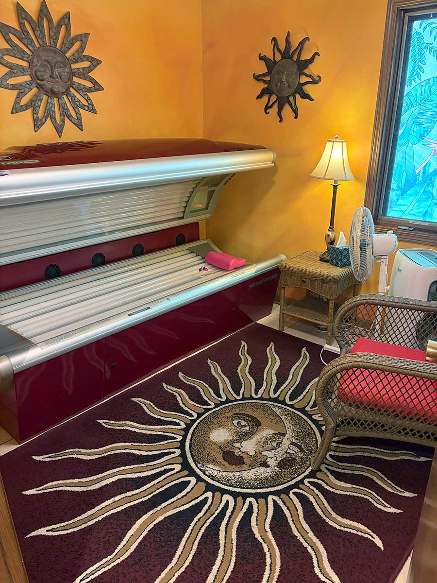 High-intensity level UV tanning bed in private suite at Celestial Sun Byron