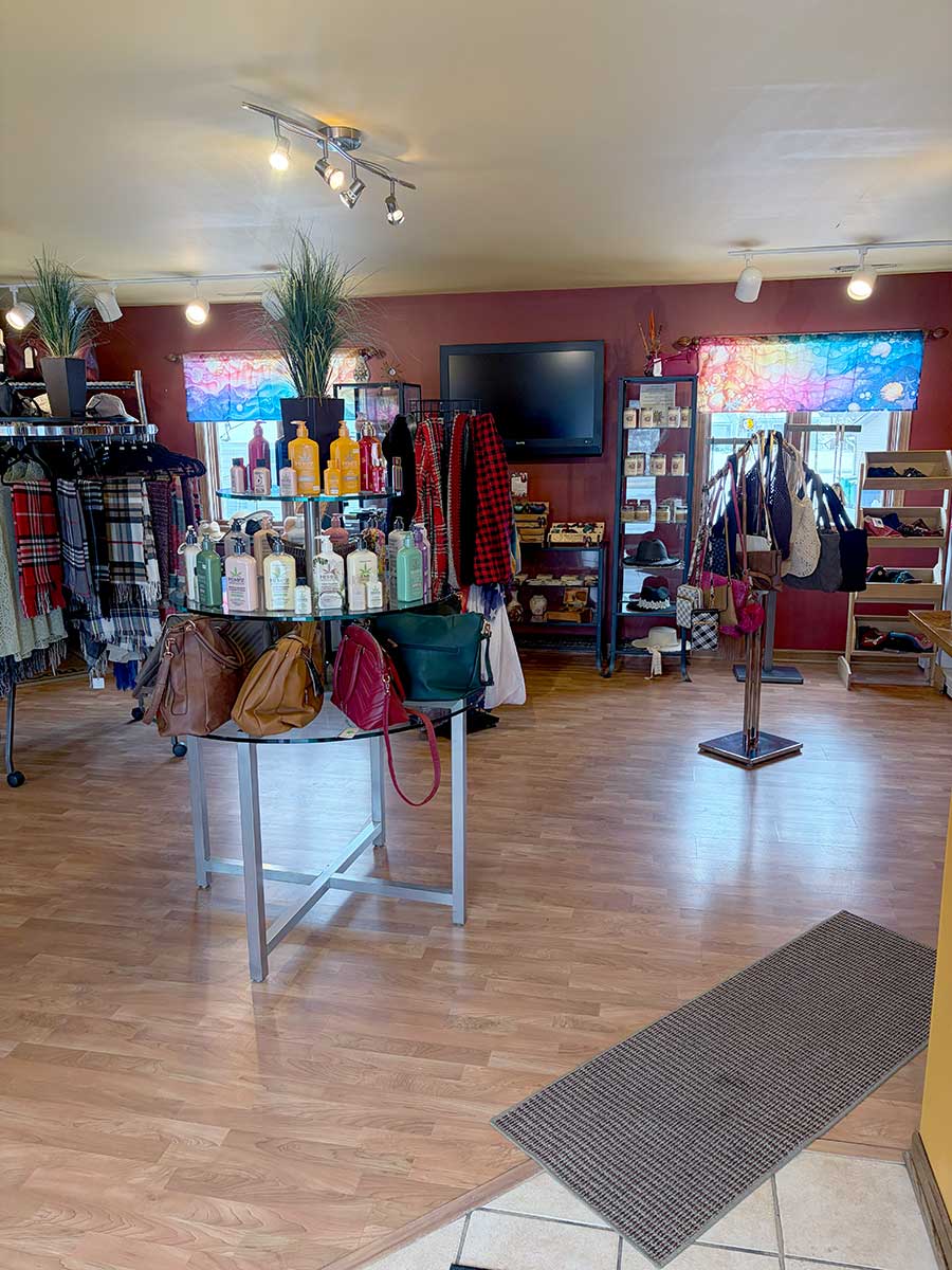 Boutique retail display featuring Hempz lotions, handbags, and apparel at Celestial Sun