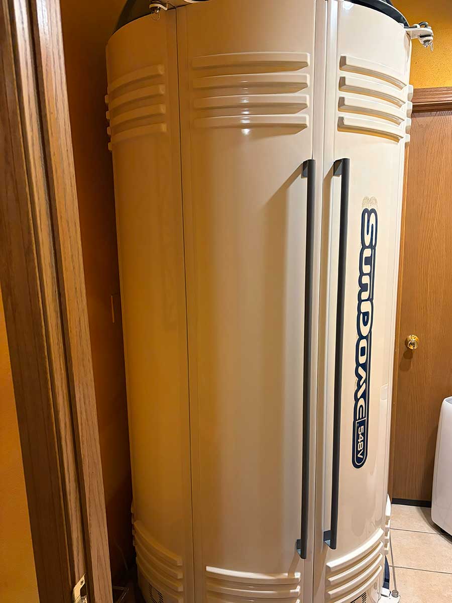 Sundome vertical booth and sunless tanning options at Celestial Sun