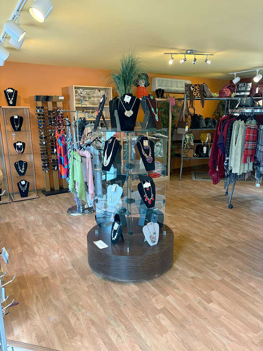 Jewelry carousel, sunglasses, and boutique gifts at Celestial Sun Byron